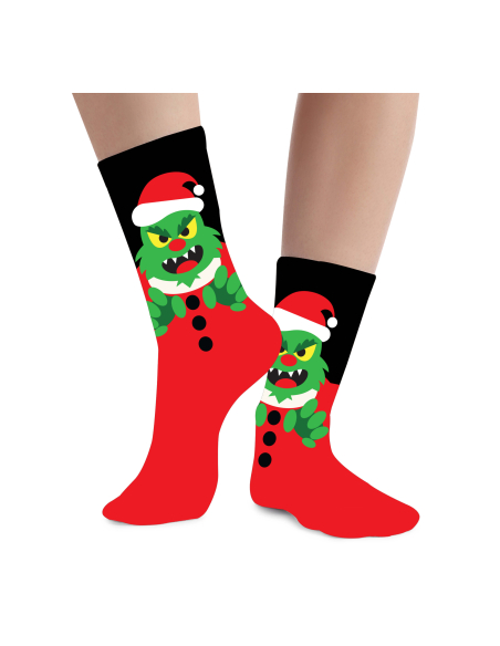 Chaussettes de Noël enfant monstre vert avec bonnet rouge